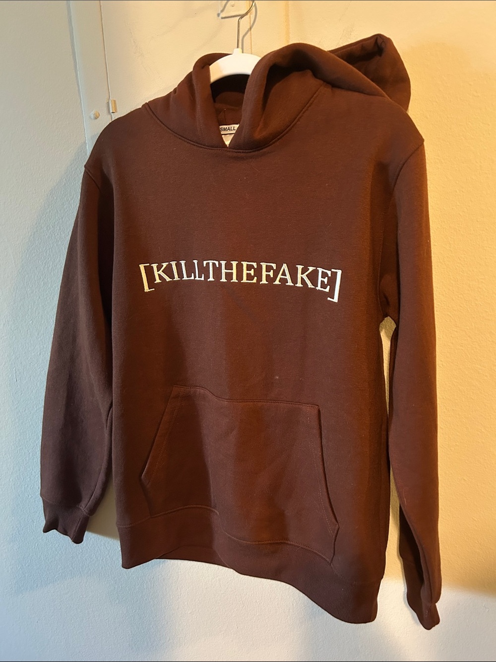 Brown Hoodie with white 'KILLTHEFAKE' embroidery